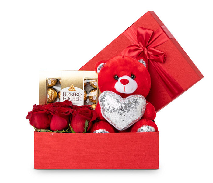 6 Red Roses, a Teddy Bear and 12 Ferrero Rocher Chocolates.