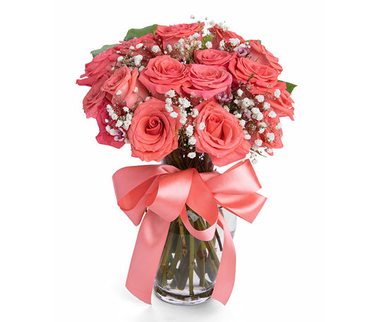 12 Bright Coral Roses with Fillers in Spring Vase