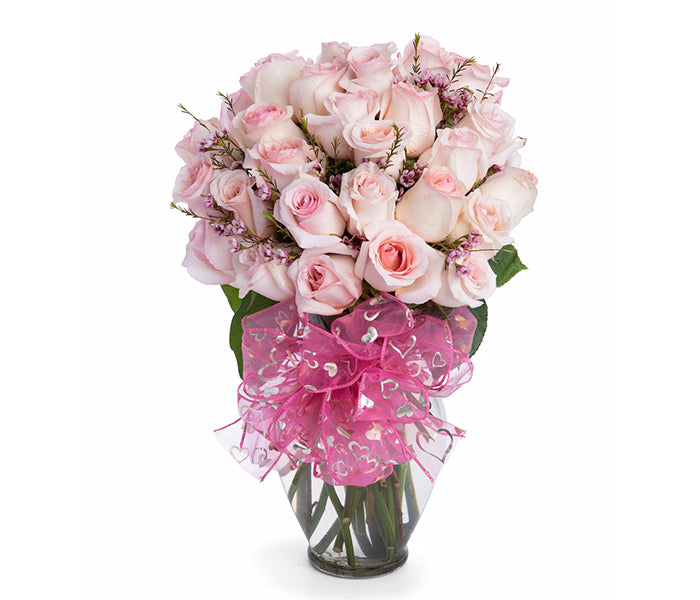 24 Light Pink Roses and Fillers in Spring Vase.